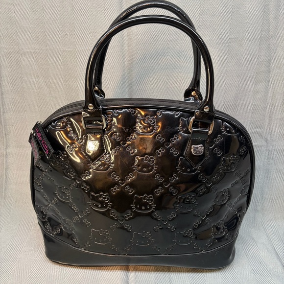 Loungefly Handbags - Lounge fly loves Hello Kitty, black patent leather dome handbag from 2012